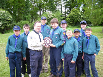 Members of 2nd Lambeg Scout Troop, winners in the First Aid Skills category, are pictured receiving the Billy McKelvey Trophy from Assistant District Commissioner Colin Watson.
