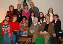 Janette McKnight pictured with Susan Alexander from India (left), Amarilis Thompson from the Dominican Republic (third from left) both of whom recently moved to live in Lisburn. Included are Gladys Thompson, Bryan Thompson and Susan and Amarilis�s children. Also included are (back row) the Mayoress - Mrs Laureen Lunn, the Mayor - Councillor Trevor Lunn, Mrs Melanie Hilary and Pastor George Hilary.