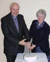 The Rev Victor Sinclair and Mrs Maje Sinclair cut a cake to mark Mr Sinclair's retirement as minister of Ballycairn Presbyterian Church. The photo was taken at a Farewell and Presentation Evening in Ballycairn Presbyterian Church Hall last Thursday (29th March). The cake was donated by Mrs Ina Gowdy.