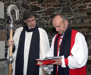 The Bishop does some last minute preparations prior to his entry into Christ Church Cathedral, Lisburn where he was received by the Bishopric of Connor. Looking on is the Bishop's Chaplain, the Rev Clifford Skillen.