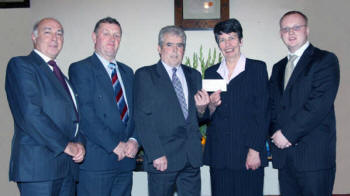 Wilson Beggs - Worshipful Master of Quilly LOL 442 presents the Harvest Offering (cheque for ?180) to Mrs Freda Mulligan in support of her daughter Ruth?s work in North West Africa. Looking on are L to R: Eric Jess - Chaplain and Worshipful District Master, Will Lough - Past District Master and Alan Roulston - Treasurer. The picture was taken at the Harvest Thanksgiving Service in Quilly Orange Hall last Sunday afternoon.