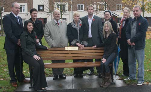 At the dedication of a memorial bench to the late Councillor Stephen Moore at Seymour Hill last Sunday morning are L to R: Paul McCord, Carol Ann McCord, Jim Moore, Marlene Moore, Darren Moore, Denise Moore, Amanda Gardner and Darren Gardner. Also included are Rachel McCord (left on seat) and Rebekah McCord (right on seat).