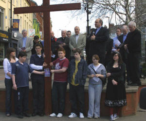 The Rev Brian Anderson, minister of Seymour Street Methodist, Lisburn is pictured giving a short Easter address in Market Square. Holding the cross are L to R: Maeve Drayne - St Patrick's, Peter McConnell - Lisburn Cathedral, Andrew Wright - Seymour Street Methodist, Jordan Vient - First Lisburn, Timothy Crangle - Christ Church, April Reynolds - Lisburn Christian Fellowship and Christina Hampton - Railway Street.