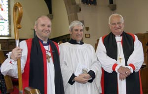 At the Centenary Service in St Colman's are L to R: The Rt Rev Alan Abernethy (Bishop of Connor), John Williams (Parish Reader) and Lord Eames,