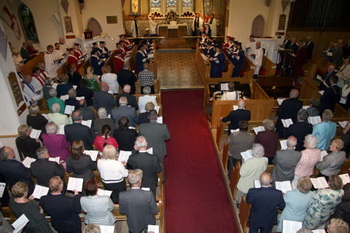 The combined choirs of Christ Church and St Paul's pictured leading the worship.