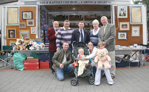 Evangelist Desmond Creelman and Lisburn Baptist's - Stephen Gray, Emma Porter and Brian Verner pictured at the Association of Baptist Churches Christian Literature Unit with John Wilkinson (left) and Lisburn family Matthew and Janet Lowry with Paige and baby Joshua.