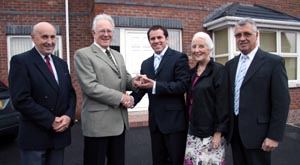 Denis Forsythe of Forsythe Contracts Ltd hands over the keys of the new manse to Pastor Nick Serb. Looking on are Ronnie Nesbitt, Irene Cummings and Norman Wright.