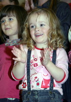 Little Anna Dundas joins in the applause after Sunday School children sang 'Thank you Lord'.