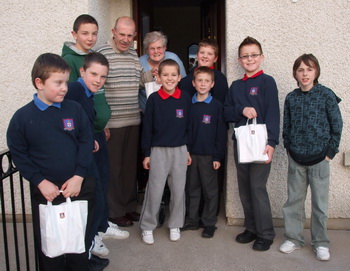 Boys from St Paul's Parish CLB pictured delivering one of their 'credit crunch parcels'.