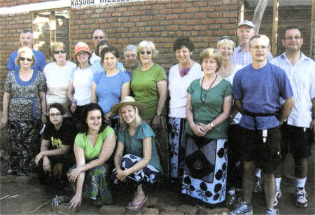 Hillsborough Presbyterian Church Mission Malawi Team outside the hall they built in Malawi. It has been named the Kasoba Hillsborough hall.