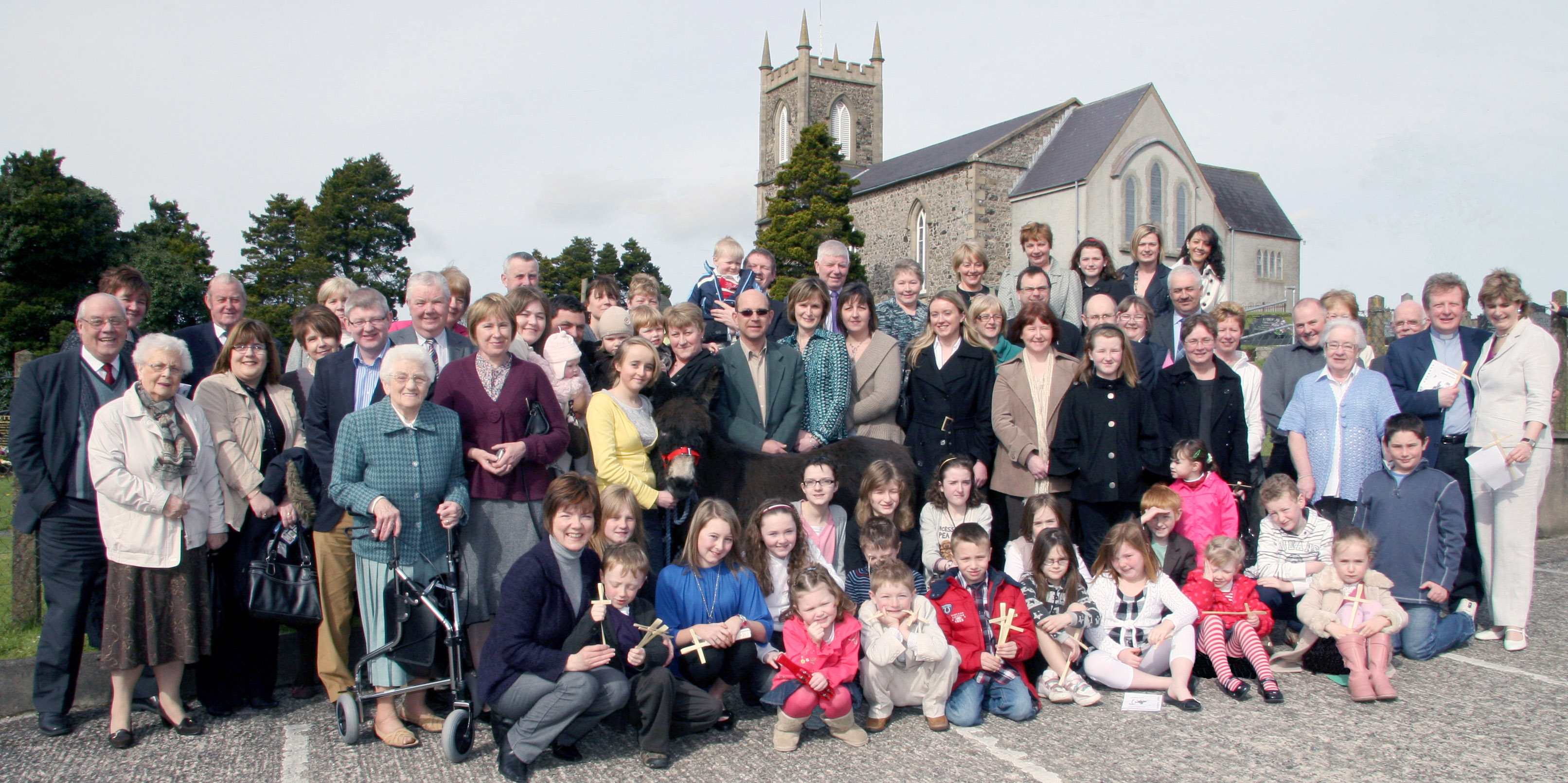 Magheragall parishioners pictured with Laura Roberts and her donkey Claud at the Palm Sunday services at Magheragall Parish Church.
