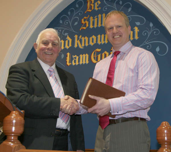 Robert Graham (Former Secretary) presents a study Bible to Myles Cordner (Church Secretary) in recognition of his outstanding work in booking excellent speakers throughout the vacancy.