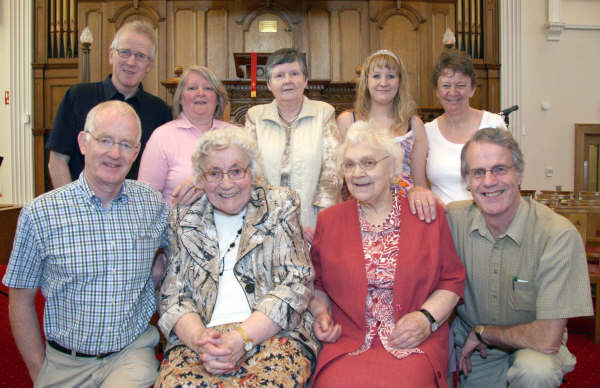 The Rev Brian Gibson (left) and Roger Thompson (right) pictured with visitors to the recently refurbished church sanctuary on Saturday 30th May. 