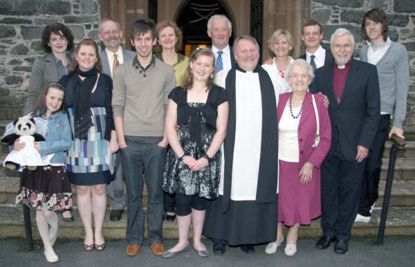 New Hillsborough Parish Curate Mike Dornan and his family pictured at his Service of Ordination in St Malachy’s Parish Church, Hillsborough on Sunday 21st June. L to R: (front row) Alex, Emma, Nick, Ciara, Mike and Elizabeth Dornan and Bishop Harold Miller (right). (back row) Fiona, Brian, Lorraine, Peter, Vivienne, Stuart and Ryan Dornan.