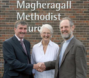 Mr Clem Gilbert, Society Steward, welcomes Rev Dr Peter Mercer and his wife Hazel to Magheragall Methodist Church.