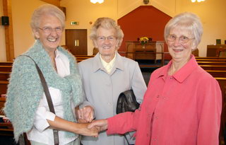 Mrs Hazel Mercer is welcomed to Magheragall Methodist Church by Mrs Eileen Allen and Miss Bobbie Wadsworth. Mrs Allen is the wife of the late Rev Ben Allen, minister of Broomhedge Methodist 1964 to 1970 and Miss Wadsworth, a retired schoolteacher, is a member of Magheragall Church Council.