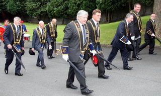 Largymore Royal Black District Chapter No 9 pictured as they approach Christ Church. L to R: Sir Knights - Tom Wilkinson (Worshipful District Master), Ron Pedlow (District Registrar), Robert Orr (District Lay Chaplain), Ian Patterson (PDM) and Stephen Law (Deputy District Master). (second row) Billy Fulton (District Lecturer), Sidney Wilson (Past County Grand Master) and George Swain (Past District Master).