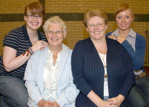 Madeline Walker pictured with her daughter-in-law Elaine and grandchildren Laura and Keri at the Holiday Bible Club in Lisburn Congregational Church.