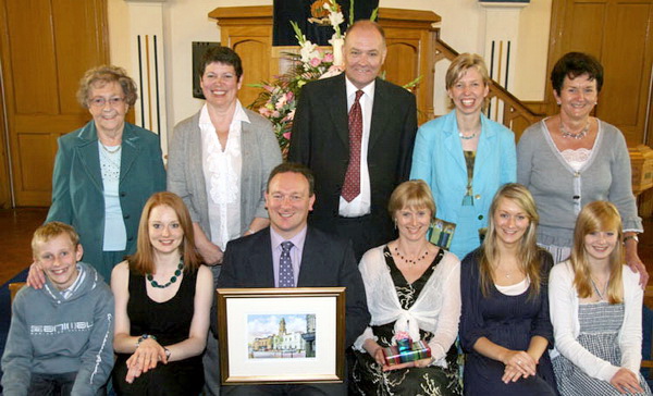 Rev Gary Glasgow and his wife Zoe pictured with their family Jonathan, Kathryn, Sarah and Lydia. Included are members of the congregation who made presentations to the family. L to R: (back row Isabel Nicholson (Organist), Lou-Ann Jess (Drumlough and Anhilt Women’s Fellowship), David Gibson (Clerk of Session), Sharon Jordon (PW) and Margaret McMullan (Choir).