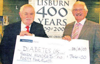 John Kelly recently presented proceeds from the first edition of the book to former Mayor, Councillor Ronnie Crawford for his chosen charity, Diabetes UK.
