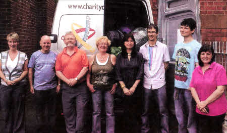 Wendy McConnell and her band of willing helpers from Lisburn Cathedral, who helped to organise the recent fundraising drive, Ioad the van with the generous donations received. From left to right are: Debbie Scott, Brian Swain, John Hume, Martie Kennedy, McConnell, Philip McConnell, Peter McConnell and Joanne Irwin.