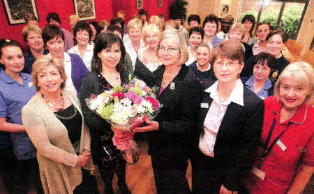 Dr. Alison Love, who is retiring from Lagan Valley Maternity unit, with staff at the hospital. US1411-102A0