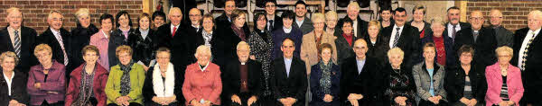 Ven Roderic West and his wife Joan pictured with the Rev Joanne Megarrell, Curate Assistant (centre in back row) and some parishioners from St John's Parish Church, Moira who attended the installation service. Included are the Rt Rev Harold Miller, Bishop of Down and Dromore (left) and Dean Stephen Lowry (right).