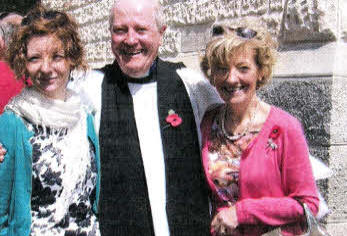Canon Alex Cheevers with his wife and daughter