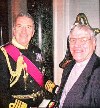 Rev. Ken Martin receiving the Merchant Navy Medal from Admiral Lord West of Spithead.