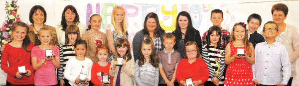 Sunday School children pictured after receiving their 10th anniversary medals. Included are Sunday School teachers Hilary Shaw, Superintendent and Margaret Strong (left) and Lynda McDonald (right)