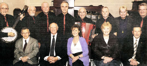 At the 'Special Praise &Thanksgiving Service' in Lisburn Christian Workers' Union Hall are L to R: (seated) Joseph Lockhart (CWU Secretary), Pastor George Sands (Guest Speaker), Doris Sands, Mavis Ross (Pianist) and Robert Watson (CWU Assistant Secretary). (back row) Sons of Zion Praise Group (Lisburn Pentecostal Fellowship, Hulls Hill).