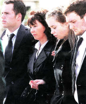 Ronan Kerr's sister Dairine, brothers Cathair and Aaron and mother Nuala arriving at murdered PSNI Constable Ronan Kerr's funeral in Beragh, County Tyrone.