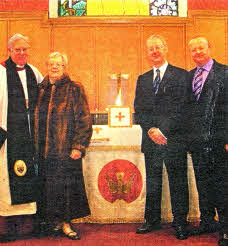 Mrs Mildred Cochrane and sons Peter and Michael along with the Dean of Connor, the Very Rev John Bond, view the new Communion Frontal