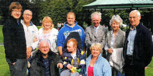 Rev Simon Genoe, Curate Assistant (left) and Denis Fullerton (right) pictured with some members of Lisburn Cathedral.