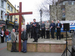 The Rev. Paul Dundas - Minister of Christ Church, is pictured giving an Easter Reading during a short act of Worship in Market Square on Good Friday 25th March 2005.