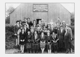Pictured at The Glad Tidings Mission Hall at the Mills, Dromore in about 1930 are L to R:  (front row) Maisie Jackson, Mrs. Magill, Miss Morrell � Missionary, Miss Hearsey, Mrs. Thomas, Mrs. Hunter, Mrs. Miskimmons and Miss Lilley.  (second row)  Barbara Ireland, Ena Purdy, Sammy Lunn, Minnie Beggs, Madge Miskimmons, Tina Jackson, Willie Purdy, Bobby Baxter, Sam Miskimmons, Evelyn Harvey and Mary Emily Harvey.  (third row)  Aggie Harvey, Maggie Harvey, Miss Kilpatrick, Maggie Hunter, Minnie McDowell, Mrs. Morrison, Mrs. Taylor and John Beggs.  (fourth row)  Ella Gibson, May Purdy, Mrs. McGrath, Sam Black, Billy Marshall, Tommy Kerr, Wilfie Taylor and Billy Hunter.