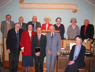 Pictured on Sunday afternoon 6th November 2005, are some of the people that gather for worship each month at Beanstown Mission Hall.  L to R:  (front) Billy McCleery, Margaret Sharkey, Robert Watson, Wesley Campbell and Rosemary Campbell - Organist.  (back row)  John Spence, Sammy Law, Harper, Kirkpatrick, Jean Kennedy, Betty Kirkpatrick, Annie McKeown and Jim Reid.