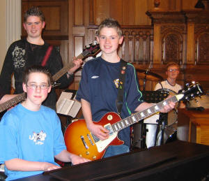 Lively music and singing at the 2005 Holiday Bible Club called �Heatwave� was led by Alan Wall - Keyboards and L to R: Adam Woods and Steven Woods - Guitar and Peter McKibben � Percussion. 