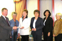 Irene Richer, chairperson of the Lisburn branch of the NI Leukaemia Research presents a cheque of �30,000 to Dennis McNorris, treasurer of NI Leukaemia Research. Looking on are other committee members of the Lisburn branch are Avril Suckling, Lovina Russell, Elva Collins and Claire Warwick. US26705SP