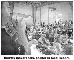 Holiday makers take shelter in local school. 