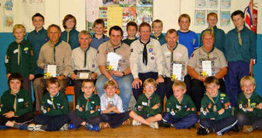 L to R:  David Elliott, Joss Toombs, Martin Young, Noel Irwin (DC), Alan Jess and Mavis Kirk pictured with 1st Anahilt Cubs and Scouts. 