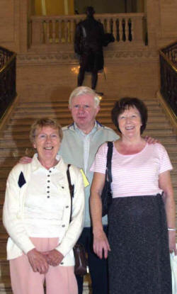 Robert Curry, Dorothy Patterson and Irene Bourton on the steps of the Great Hall.