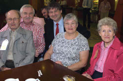 Eric Scott, John Kelly, May Campbell and Ella-May Agnew are joined by Basil McCrea MLA during a tea break. 