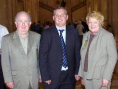 John and Charlotte Burleigh with John McCallister MLA in the Great Hall.