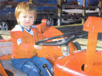 Two year old Patrick Leech from Dromore on a Massey Ferguson35 at the Glenavy and District Vintage) Car Rally. US1007-509C0