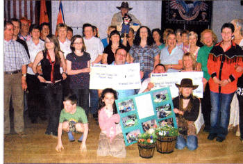 Members and friends of 'Brookmount Dance Ranch' Line Dance Club presenting their annual charity funds to 'Seymour Hill Horticultural Unit' and 'Lisburn Senior Gateway Club'.