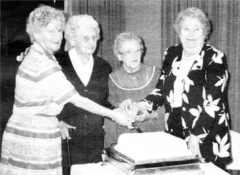 Members of Hillhall WI cut the cake to celebrate their 50th anniversary at a special dinner held in Forte Posthouse Hotel in Dunmurry back in 1997