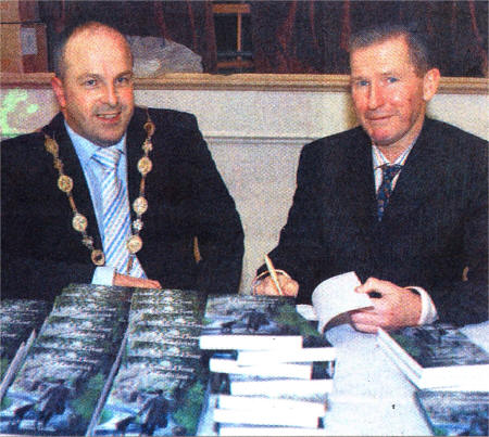 Dr Owen Gallagher at the recent launch of his new book with Lisburn Mayor, Councillor James Tinsley. US4507-355DW