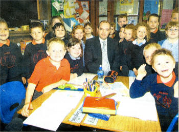New Hilden Intergrated Primary School Principal William Gourley pictured with children in the school. US2307-112A0