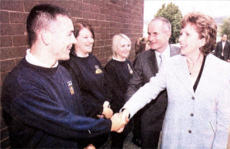 President Mary McAleese and her husband Martin are greeted by head boy Paul Cassidy and head girl Lisa Donaghy at St Colm's HS Pic Mal McCann